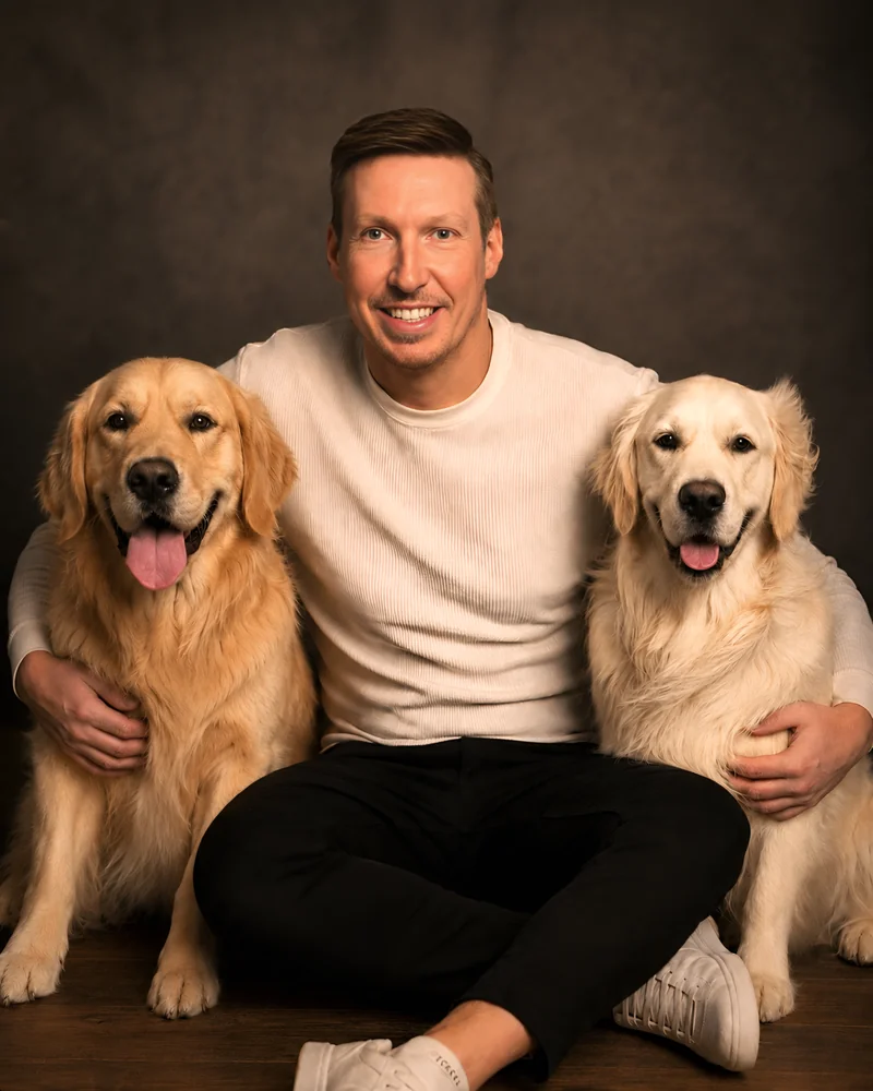 Chris Gillard, founder of Double Golden Digital, with his two golden retrievers